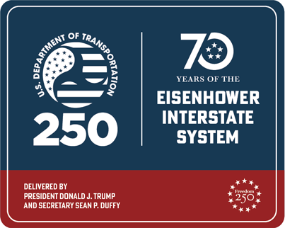A navy and red highway sign: the U.S. Department of Transportation 250 mark on the left, 70 Years of the Eisenhower Interstate System on the right, and Delivered by President Donald J. Trump and Secretary Sean P. Duffy along the bottom.
